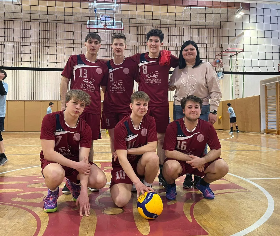 I stand with another DD AMS volleyball tournament team