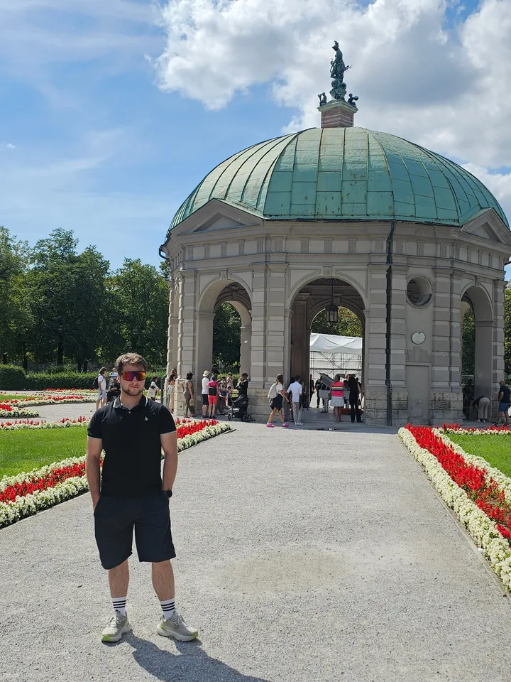 I stand in the Munich Hofgarten after the academic programme